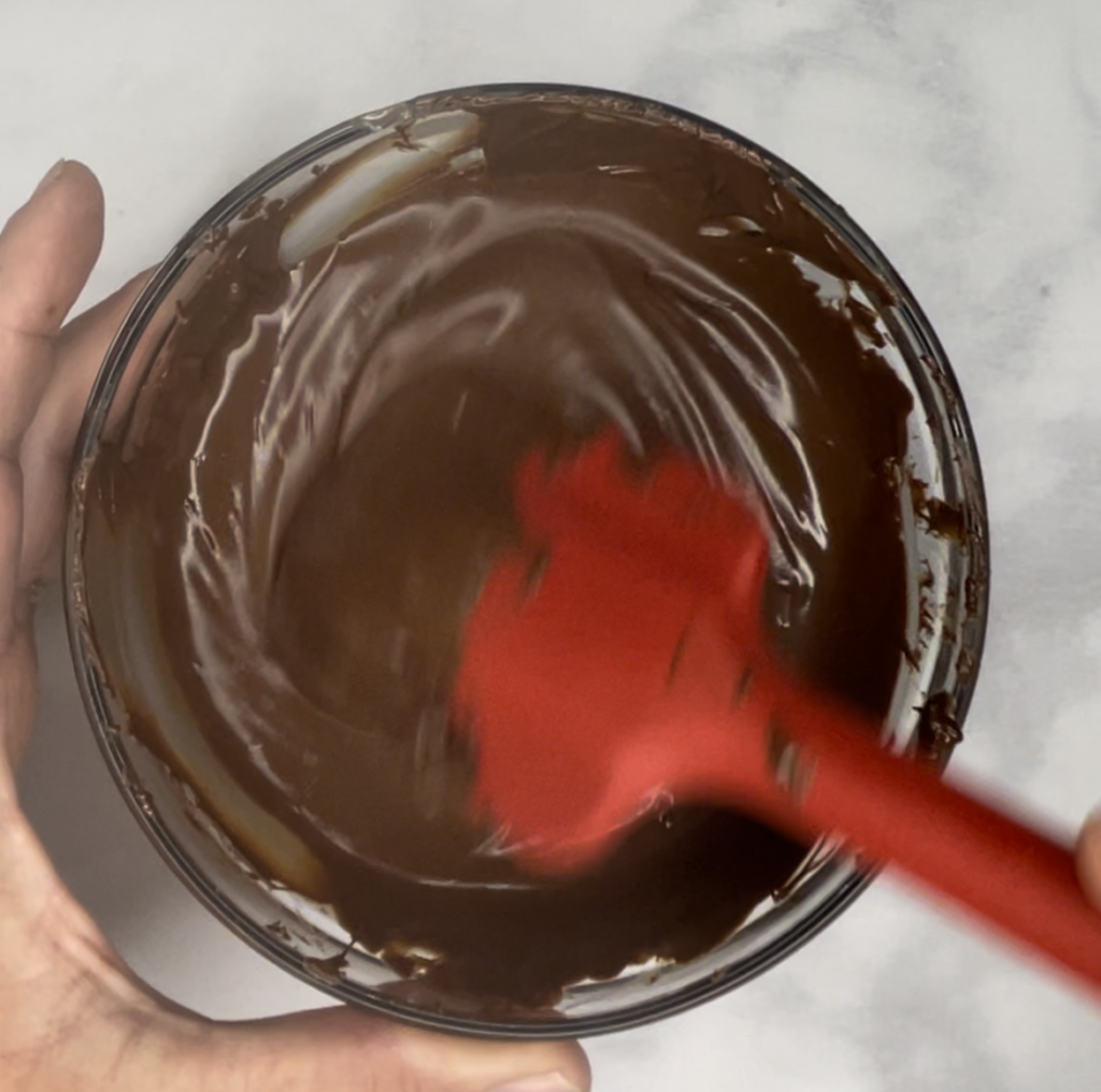 Melted chocolate for the Oreo Mousse Cake  chocolate mousse layer