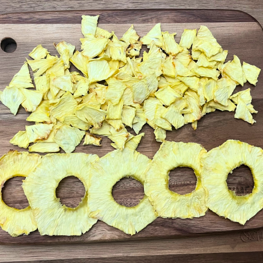 dehydrated pineapples on wooden board