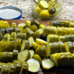 Pickles cut into chunks on a cutting board
