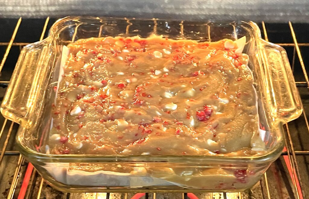 An image of the blondies going into the oven.