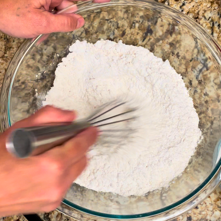 Mixing dry ingredients in a glass bowl