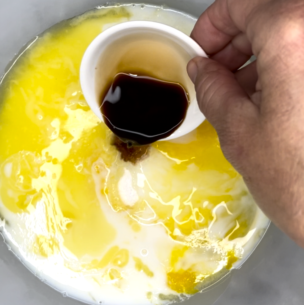 Image showing pouring vanilla into the mixture.