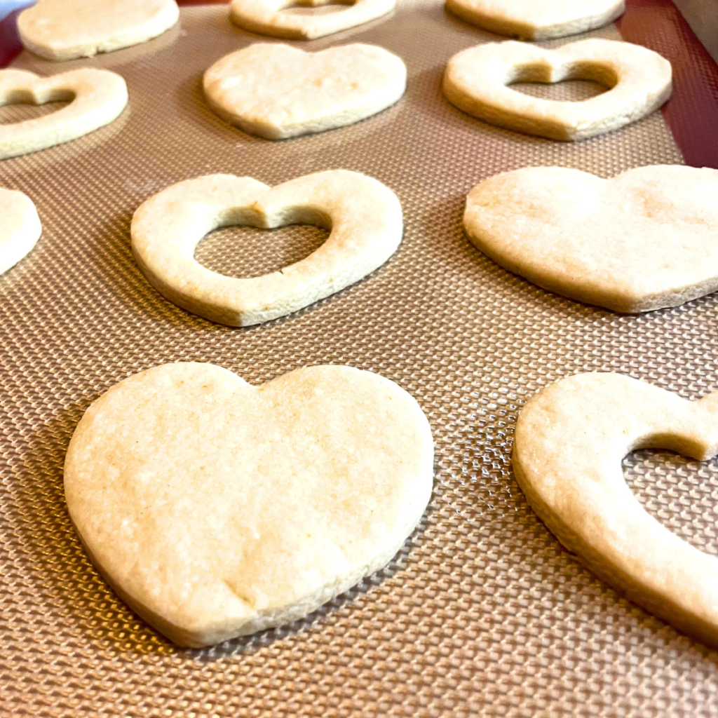 Baking sheet with Heart cookies straight from the oven.