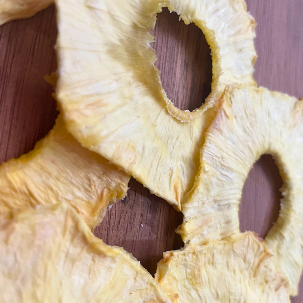 Close up image of completely dehydrated pineapple rings